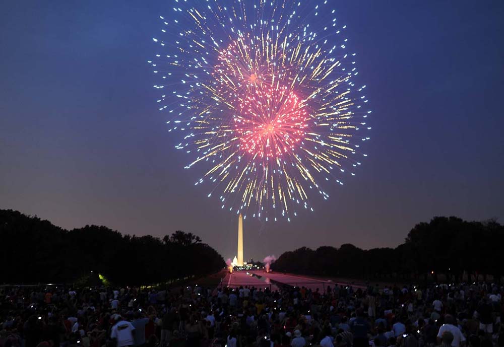 Fireworks illuminate the night sky over the Washington Monument